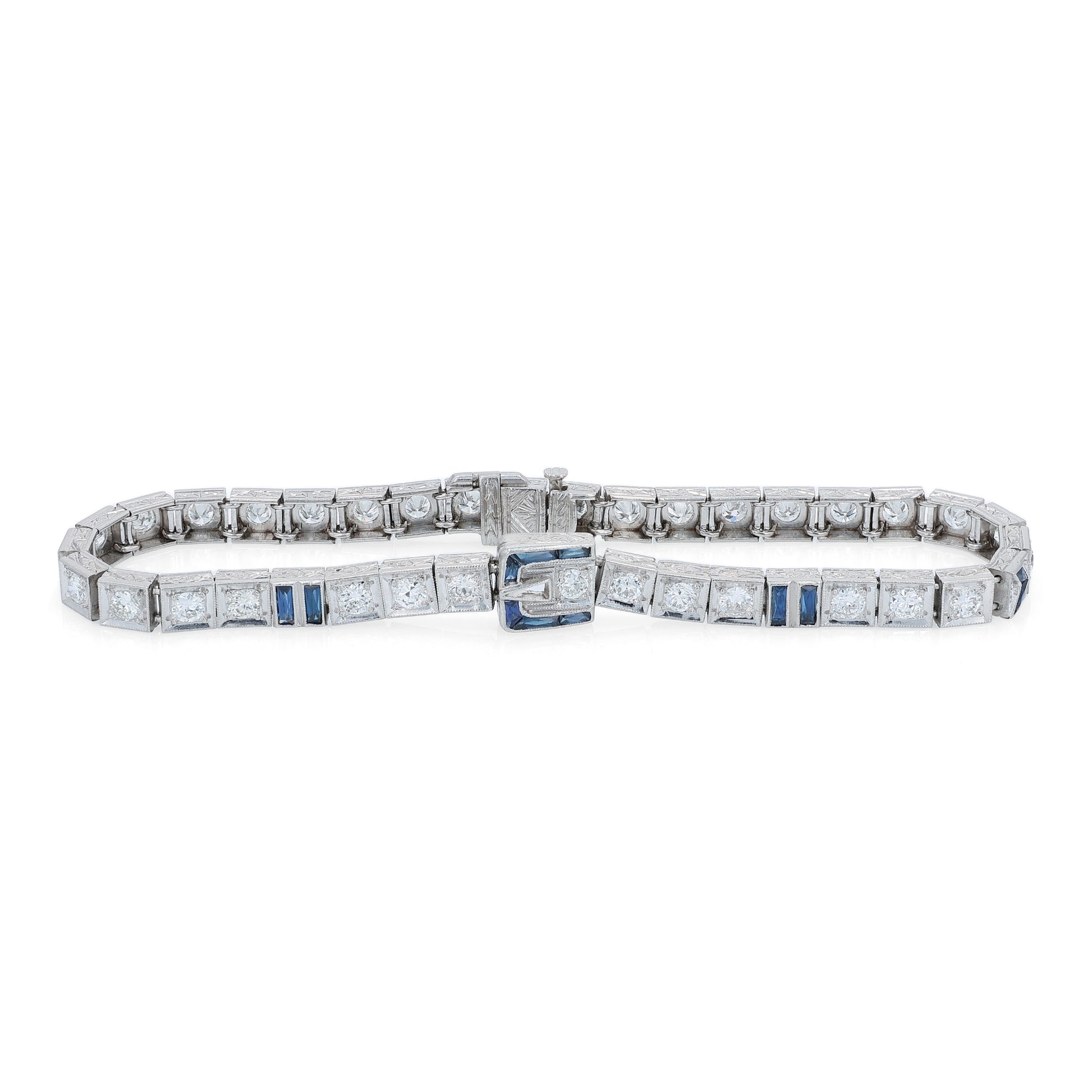 Platinum buckle design diamond and synthetic sapphire tennis bracelet on a white background