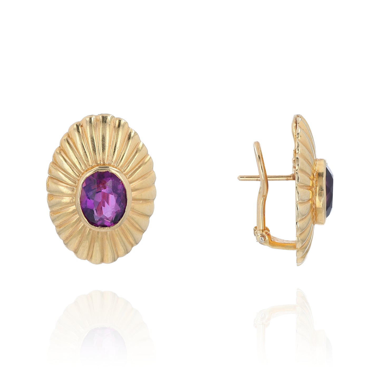 Yellow gold ribbed frame design oval amethyst stud earrings on a white background