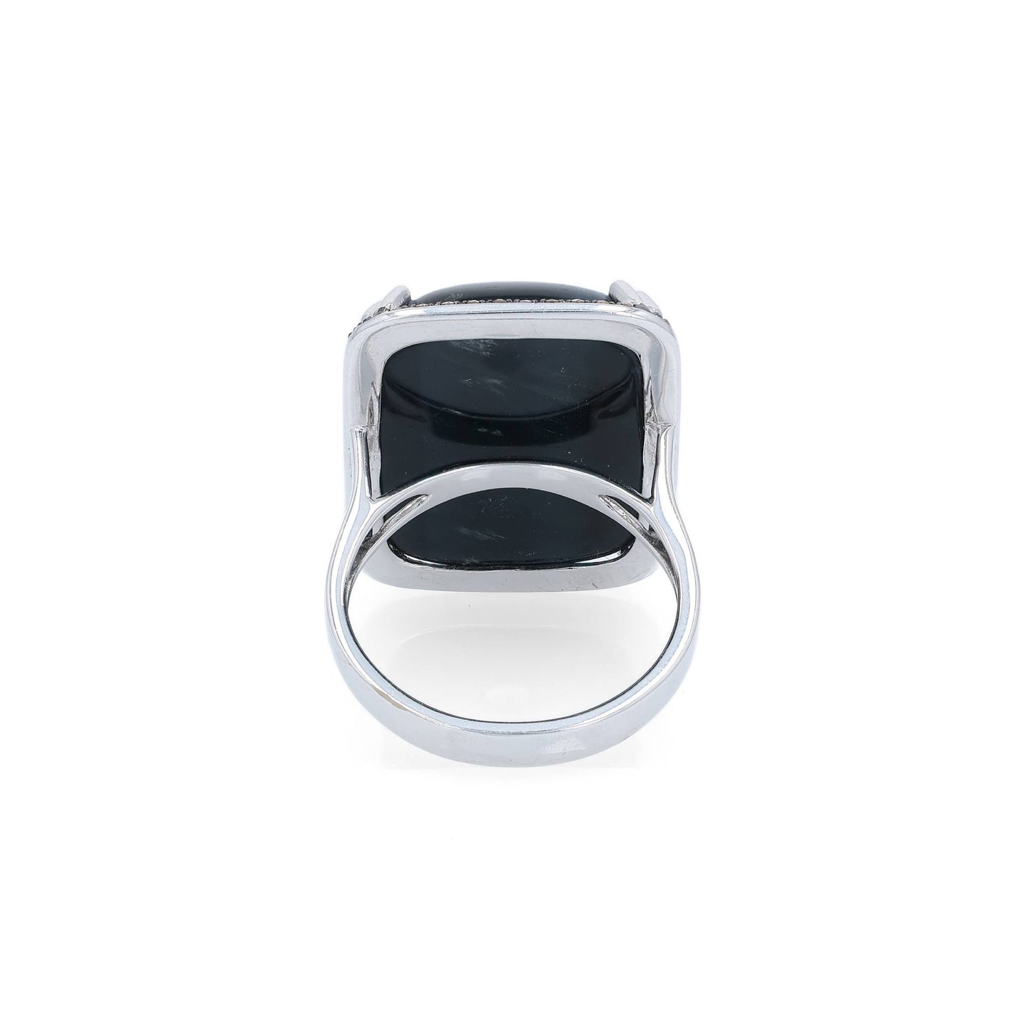 White gold ring with a rectangle cushion cabochon dyed blue cat's eye and a brown single cut diamond halo on a white background