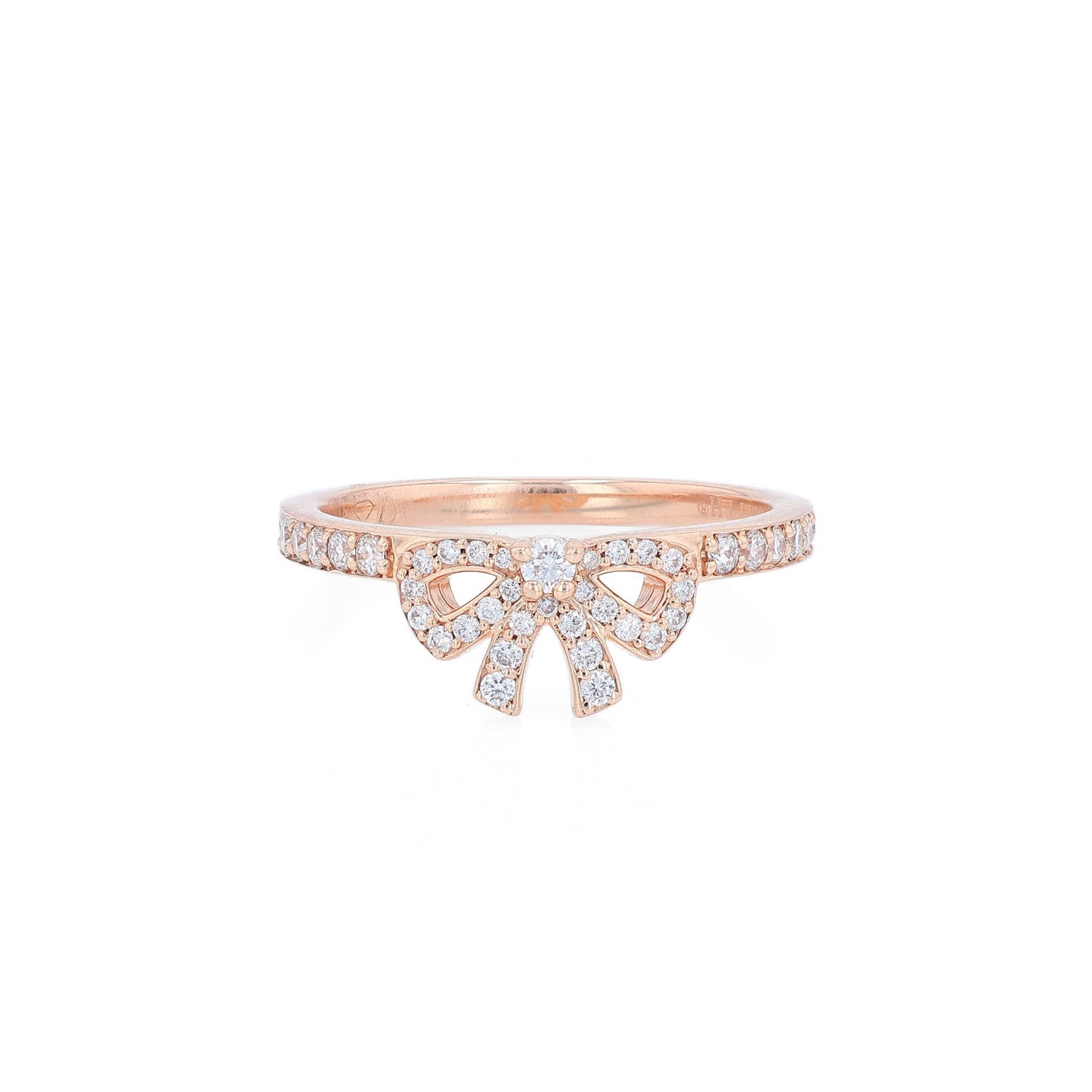 Rose gold pave bow design diamond ring on a white background