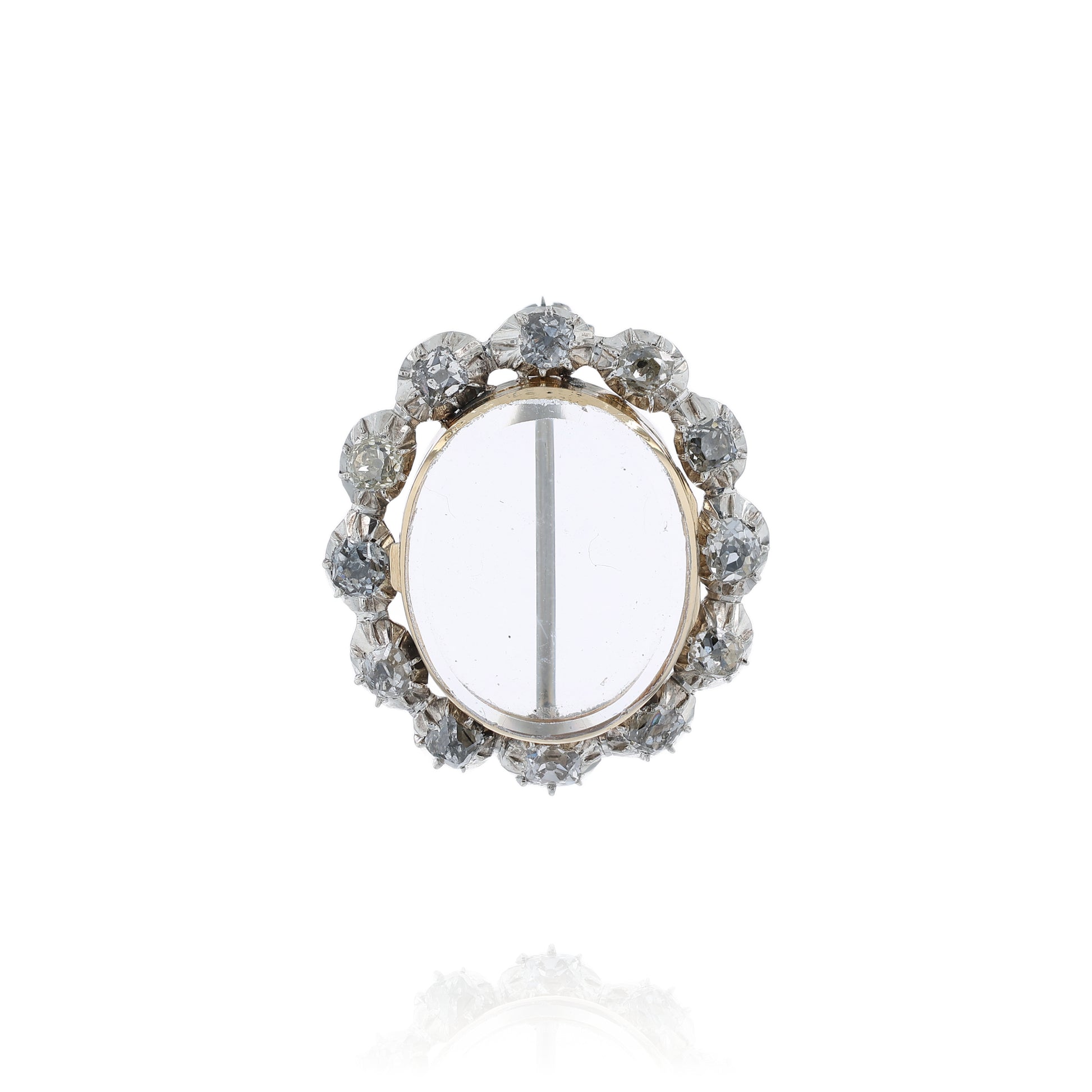 Two-tone gold pin with a clear locket center and surrounding diamonds on a white background