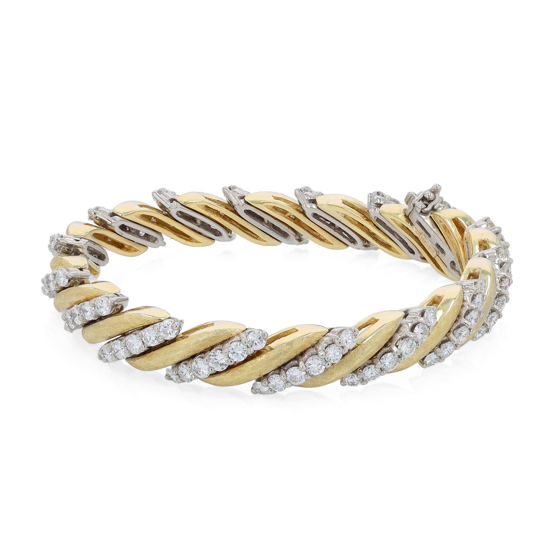 Two-tone gold bracelet with diamond accents on a white background