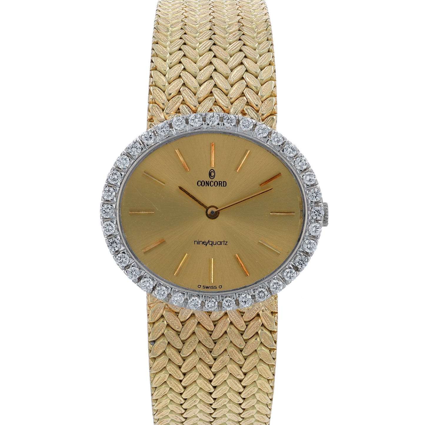 Gold Concord watch with a diamond bezel and a champagne dial on a white background