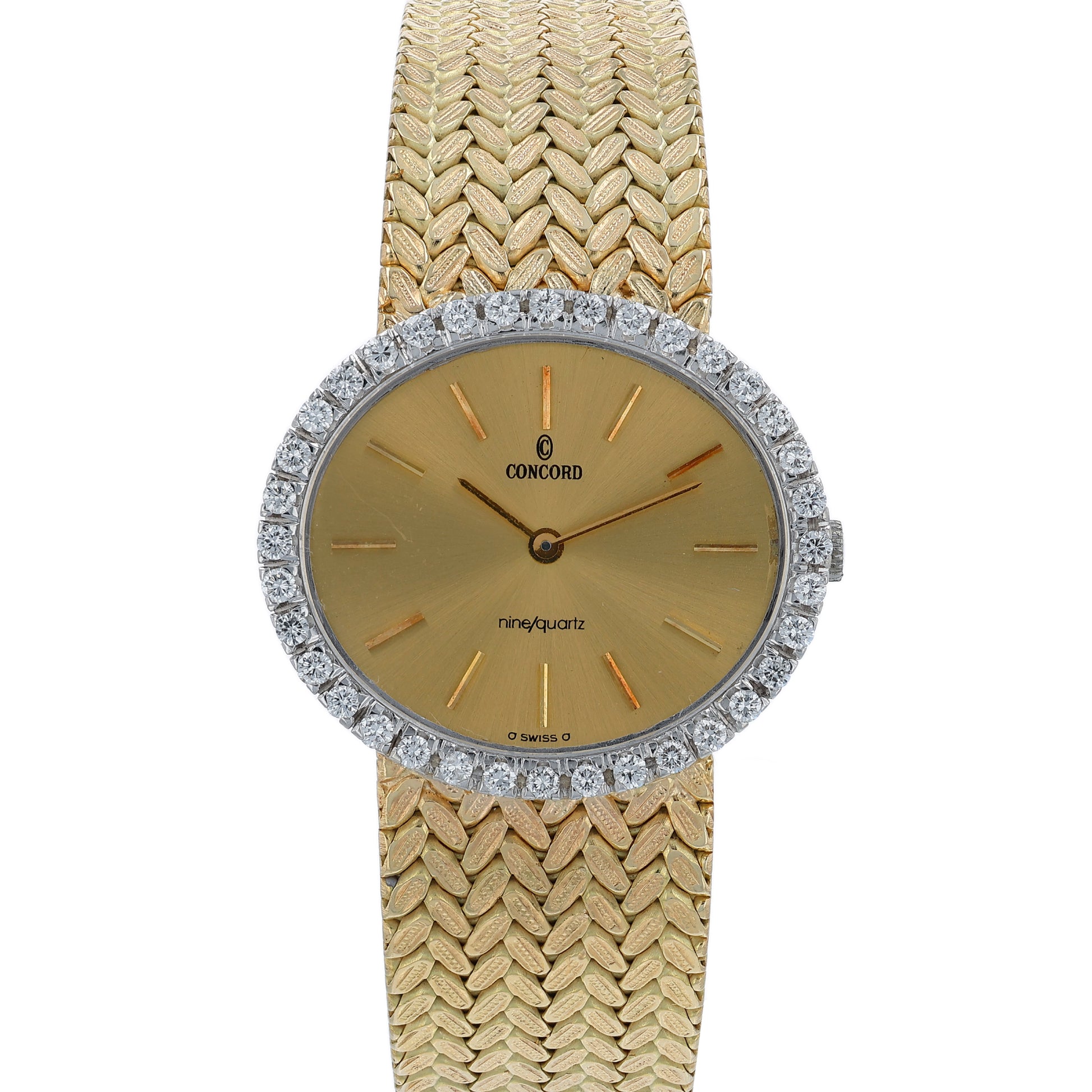 Gold Concord watch with a diamond bezel and a champagne dial on a white background