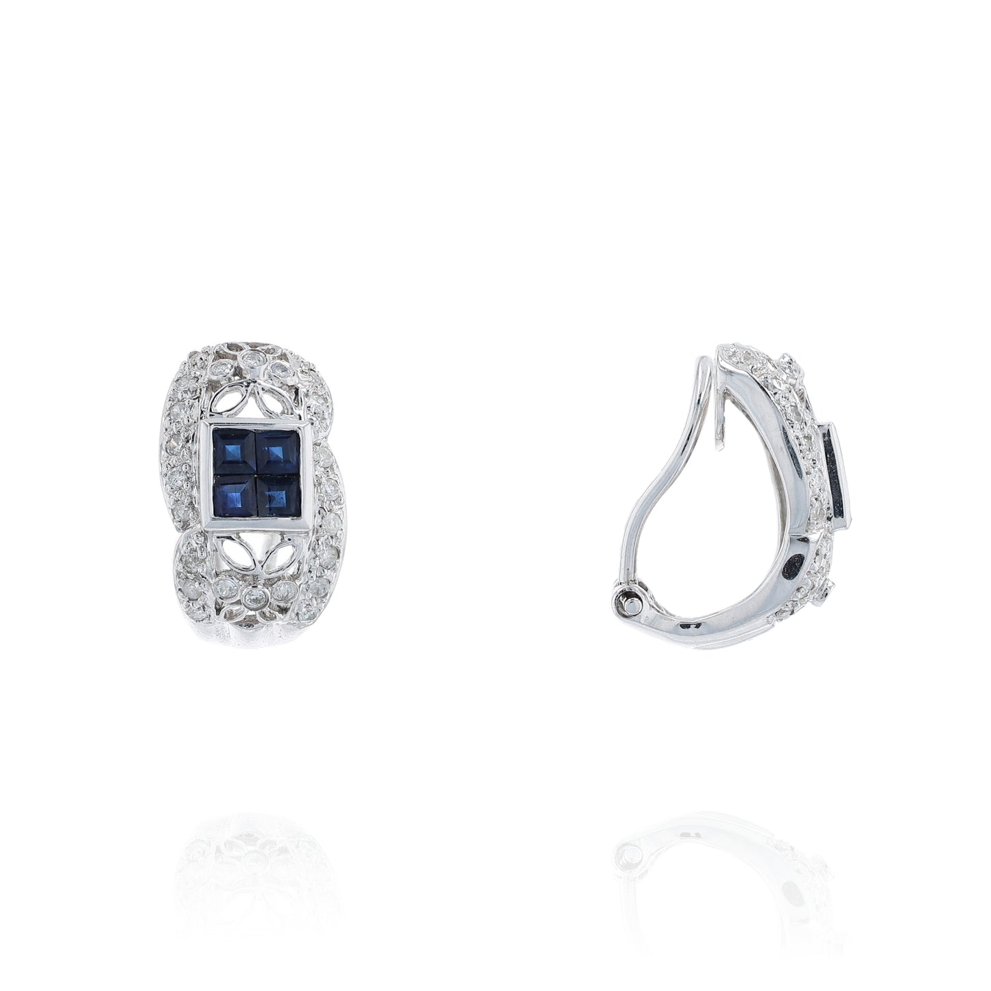 Pair of white gold diamond hoop earrings with multi-square blue sapphire centers on a white background
