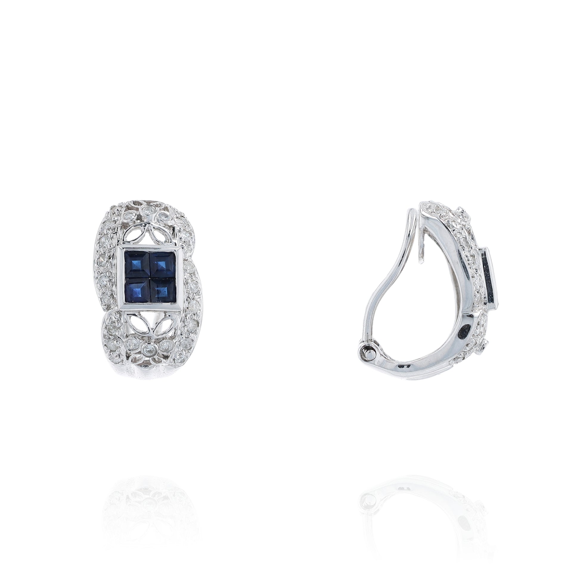 Pair of white gold diamond hoop earrings with multi-square blue sapphire centers on a white background