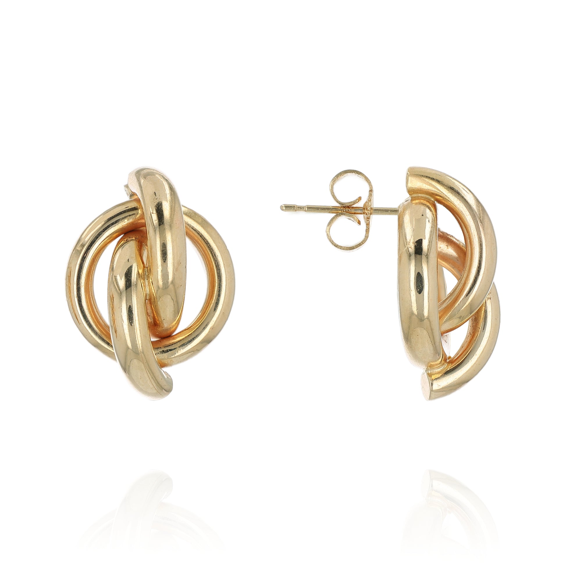 Gold knot earrings on a white background