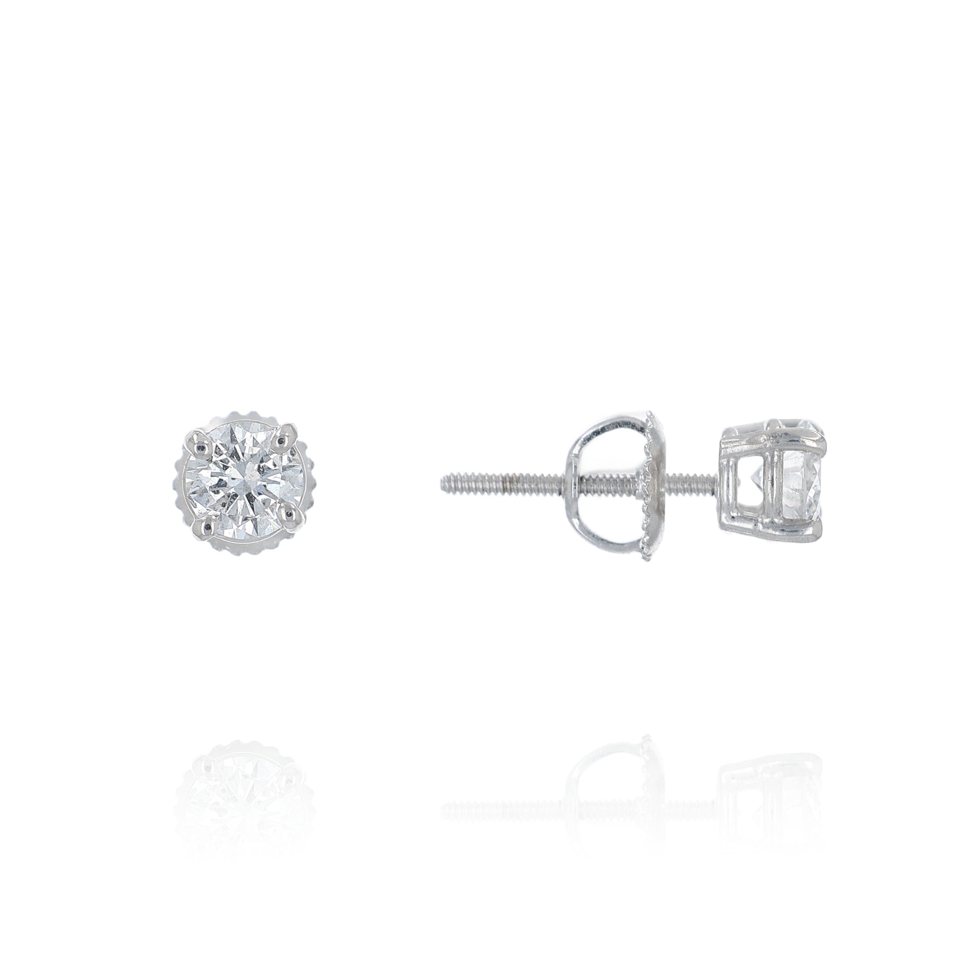 Pair of white gold round diamond stud earrings on a white background