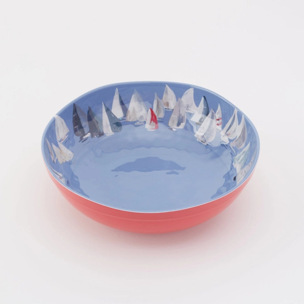 Decorative bowl with sailboat design on a white background