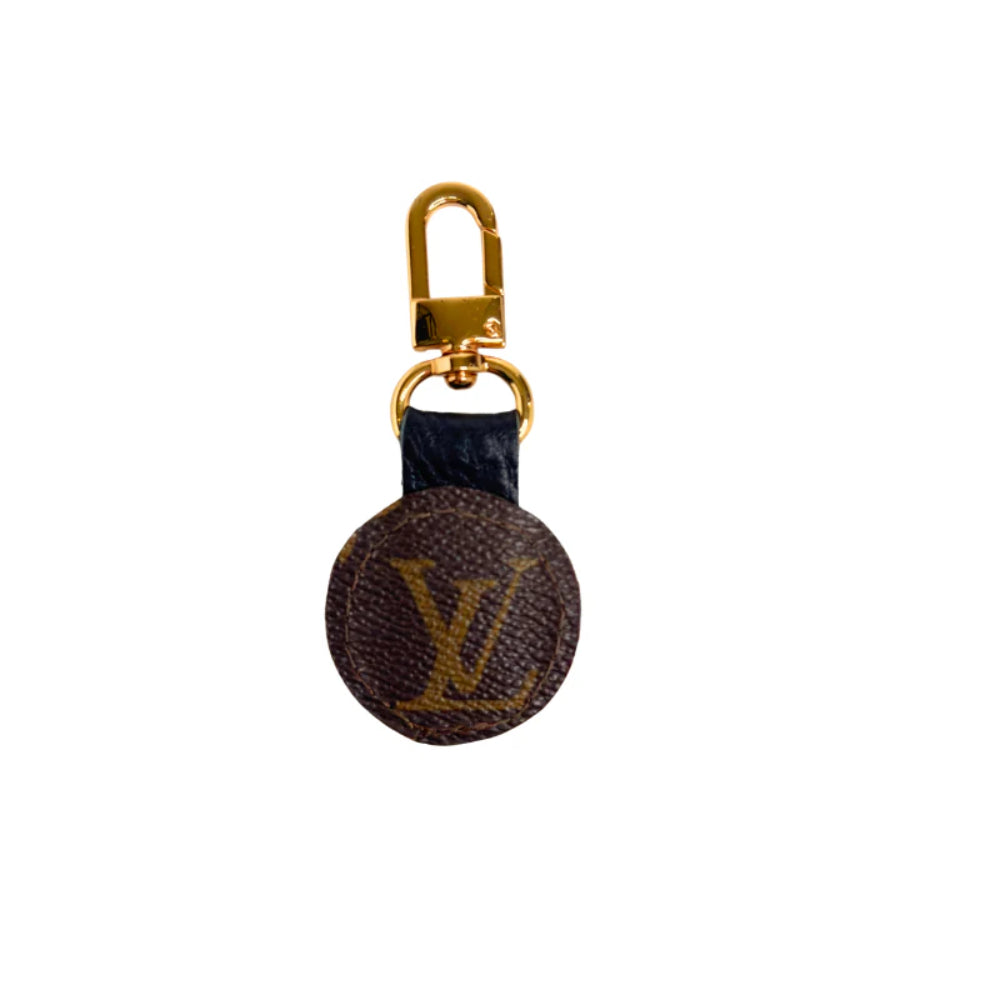 Louis Vuitton keychain with monogram pattern on a white background
