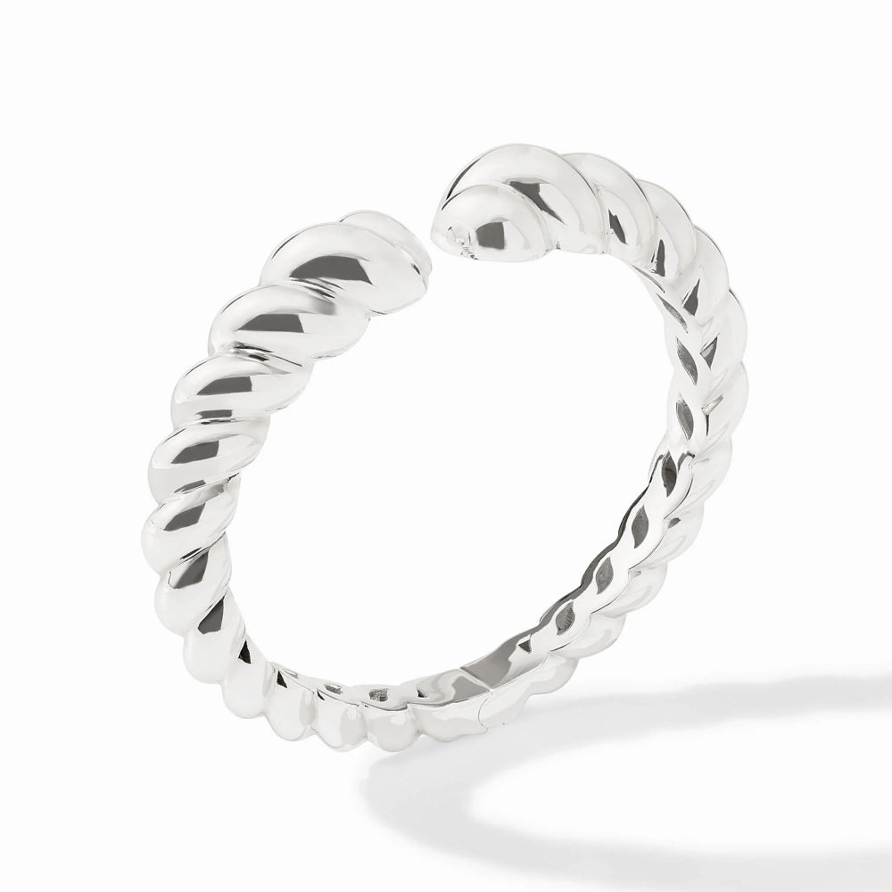 Silver ring with a textured design on a white background