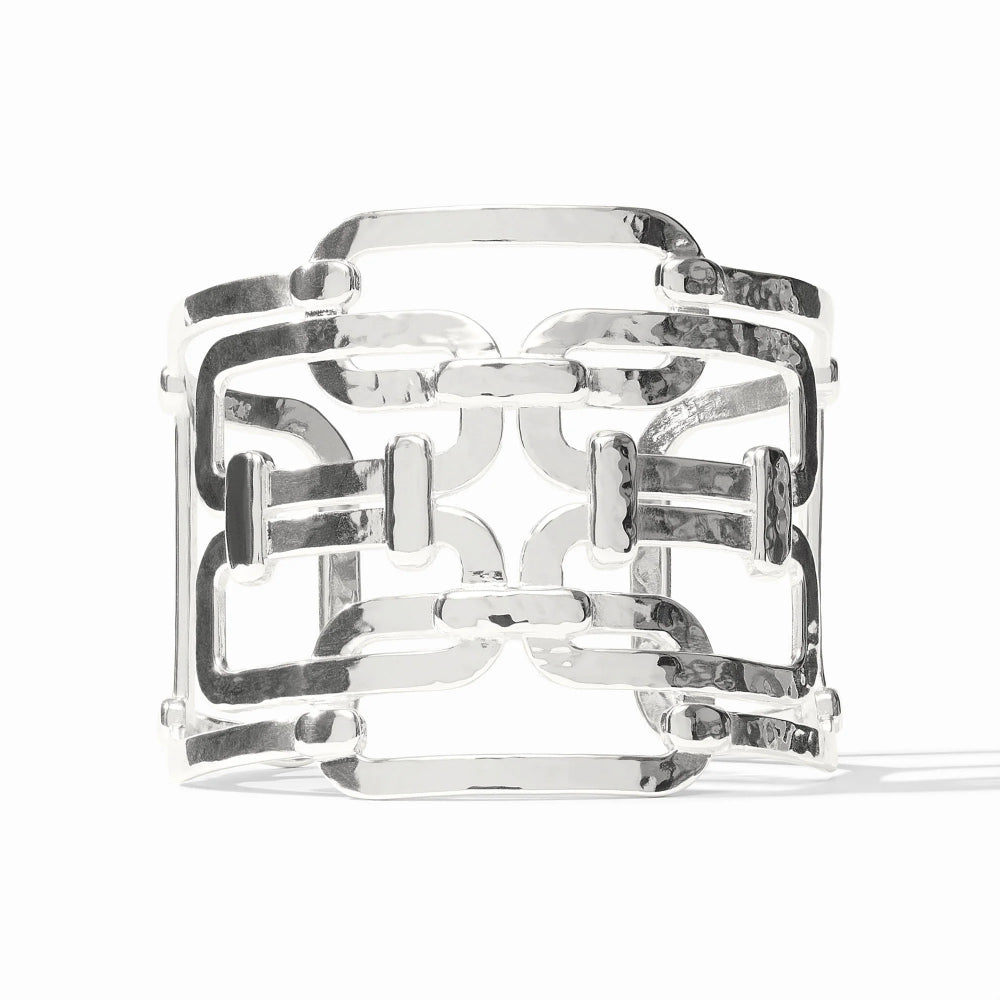 Silver bracelet with intricate design on a white background