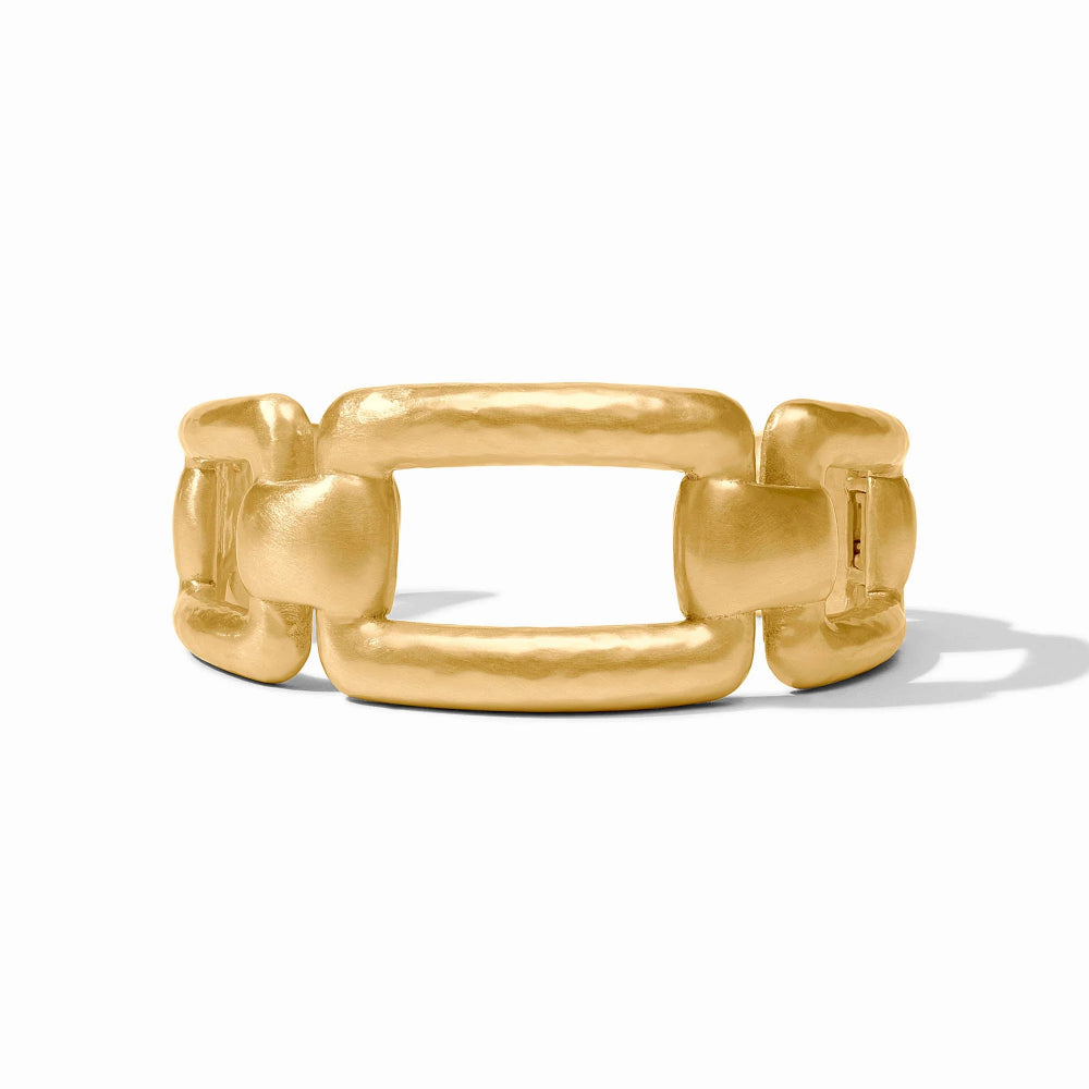 A chunky gold chain-link cuff bracelet with a textured, hammered finish, shown on a clean white background with a soft shadow.