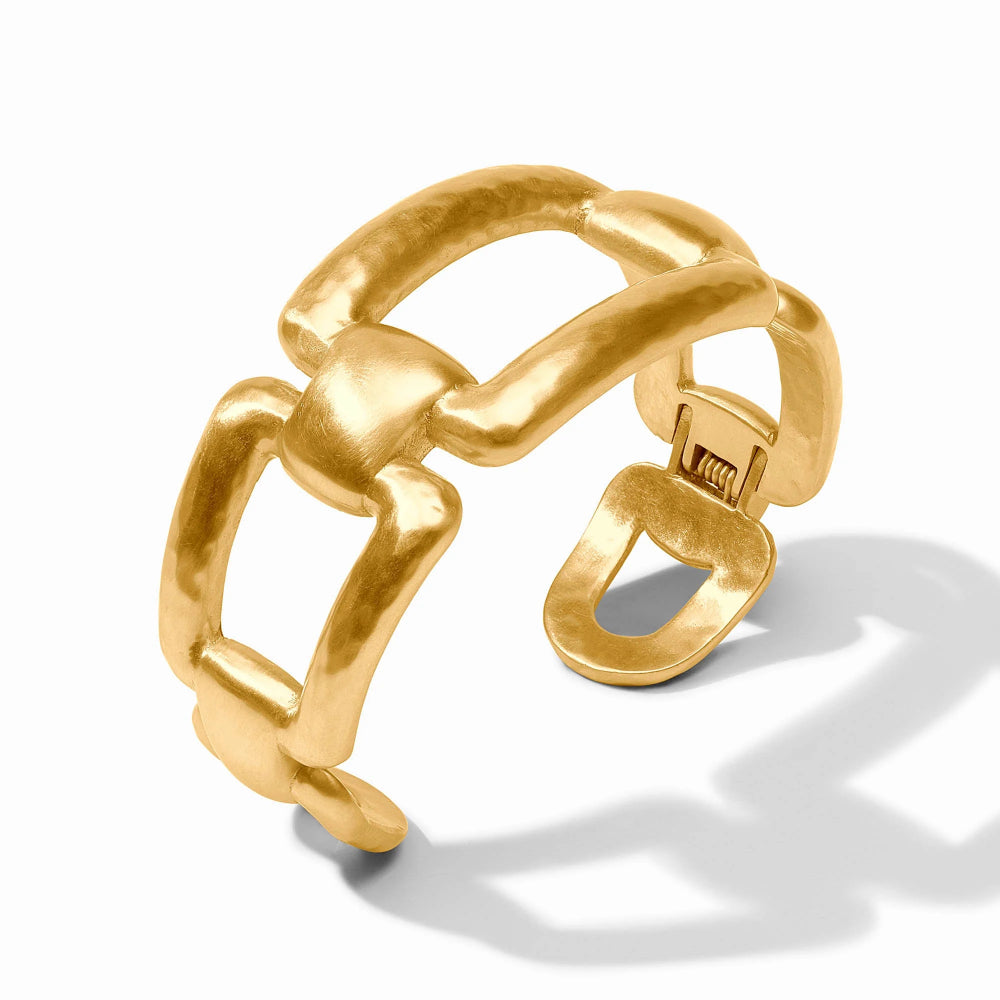 Gold ring with a unique design on a white background