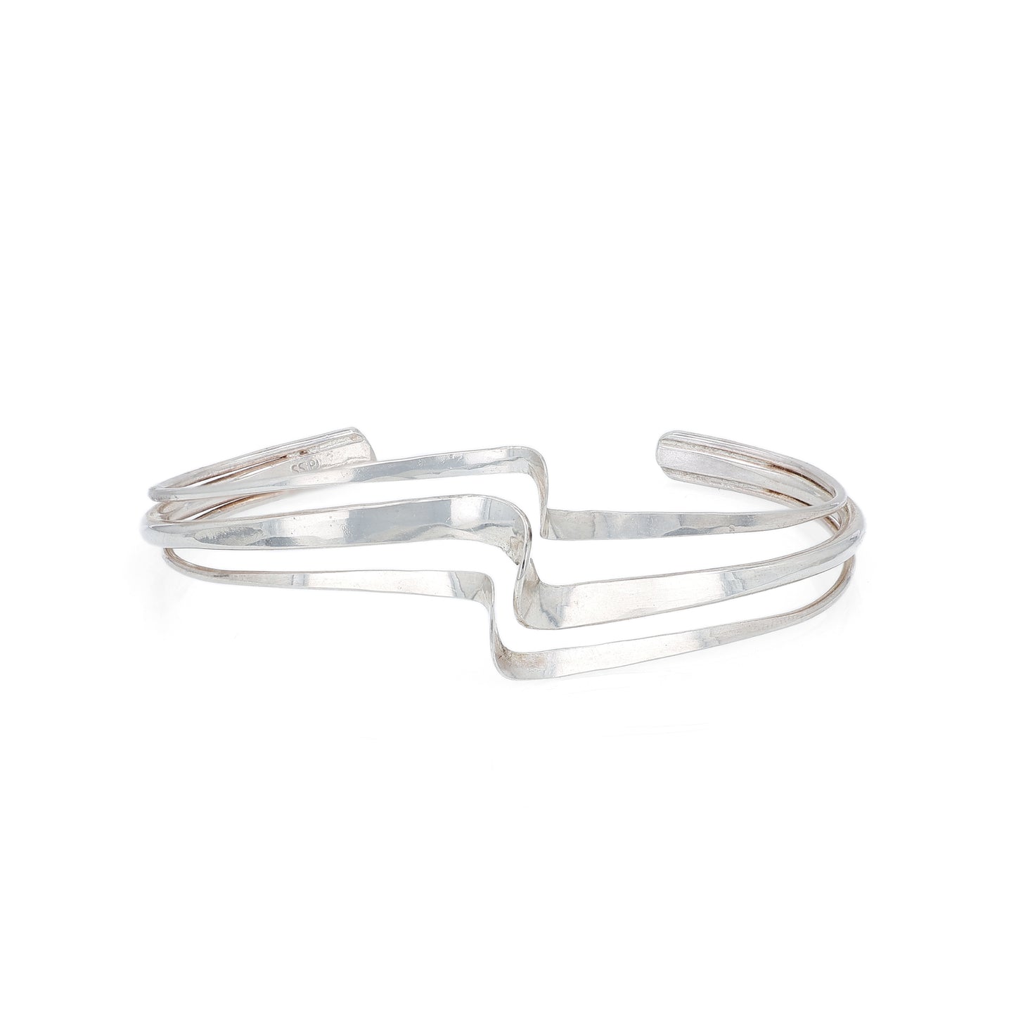 Silver polished wave design triple row bracelet on a white background