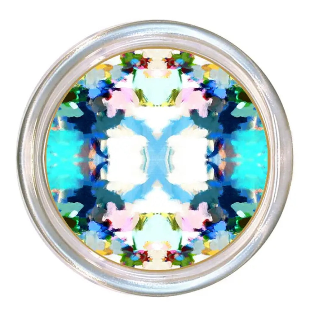 A round silver-toned coaster with a highly colorful, symmetrical abstract kaleidoscope pattern in the center, set against a plain white background.