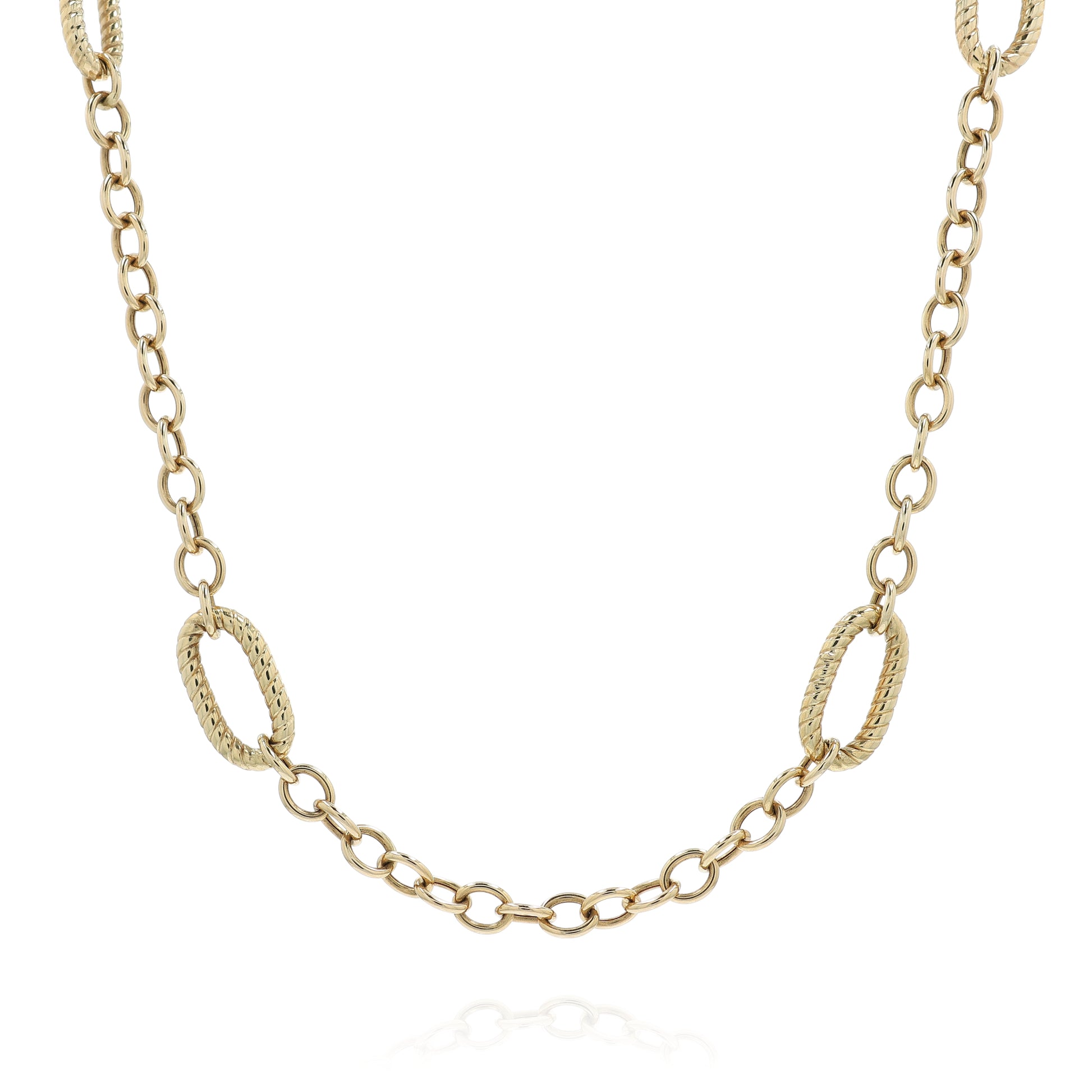 Yellow gold polished and twisted link chain necklace on a white background