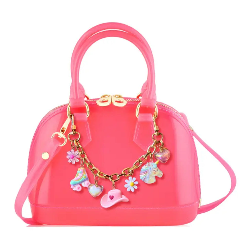 Bubble Gum Color handbag with charm strap on a white background