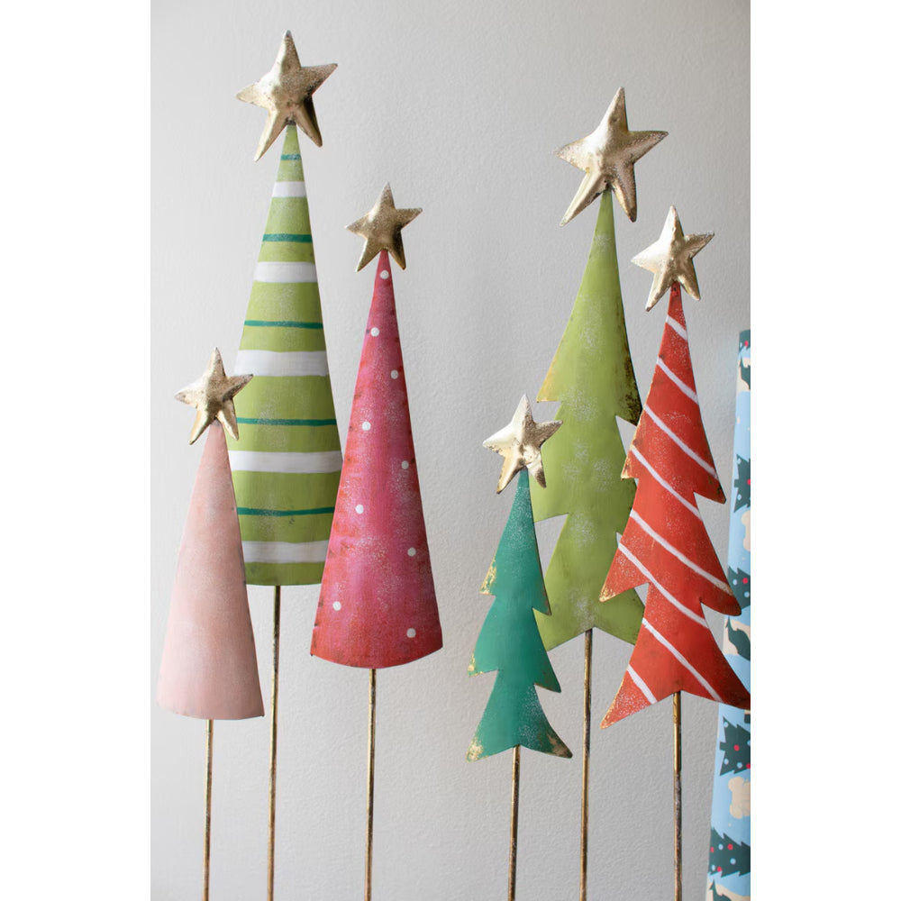 Colorful paper Christmas trees with star toppers on a white background