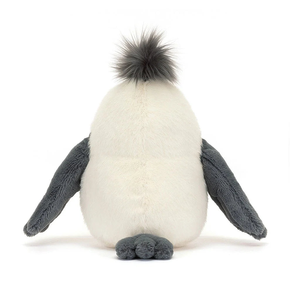 A photo of the back of a plush toy penguin with a white body, gray wings, and an orange beak on a white background