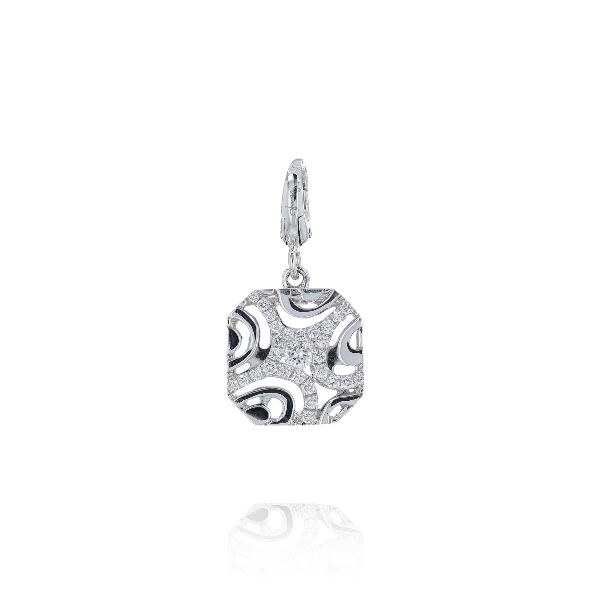 White gold filigree design cushion shaped diamond charm pendant on a white background