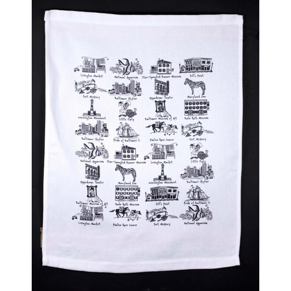 White towel with black printed designs of landmarks on a black background
