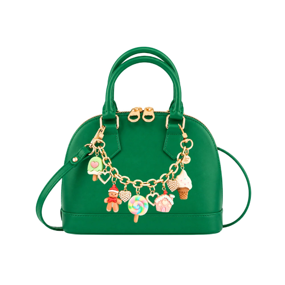 Green hand bag with holiday themed charms on a white backround. 