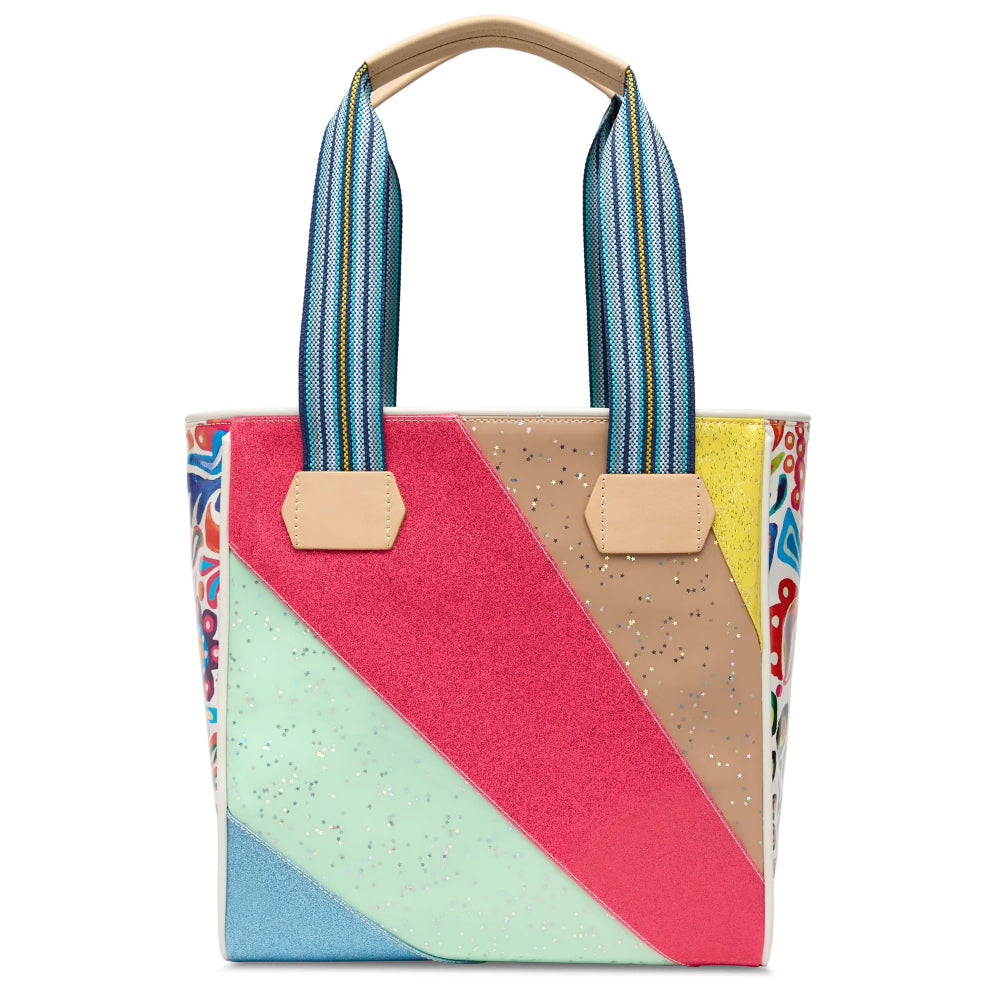 Colorful tote bag with geometric design and striped handles on a white background