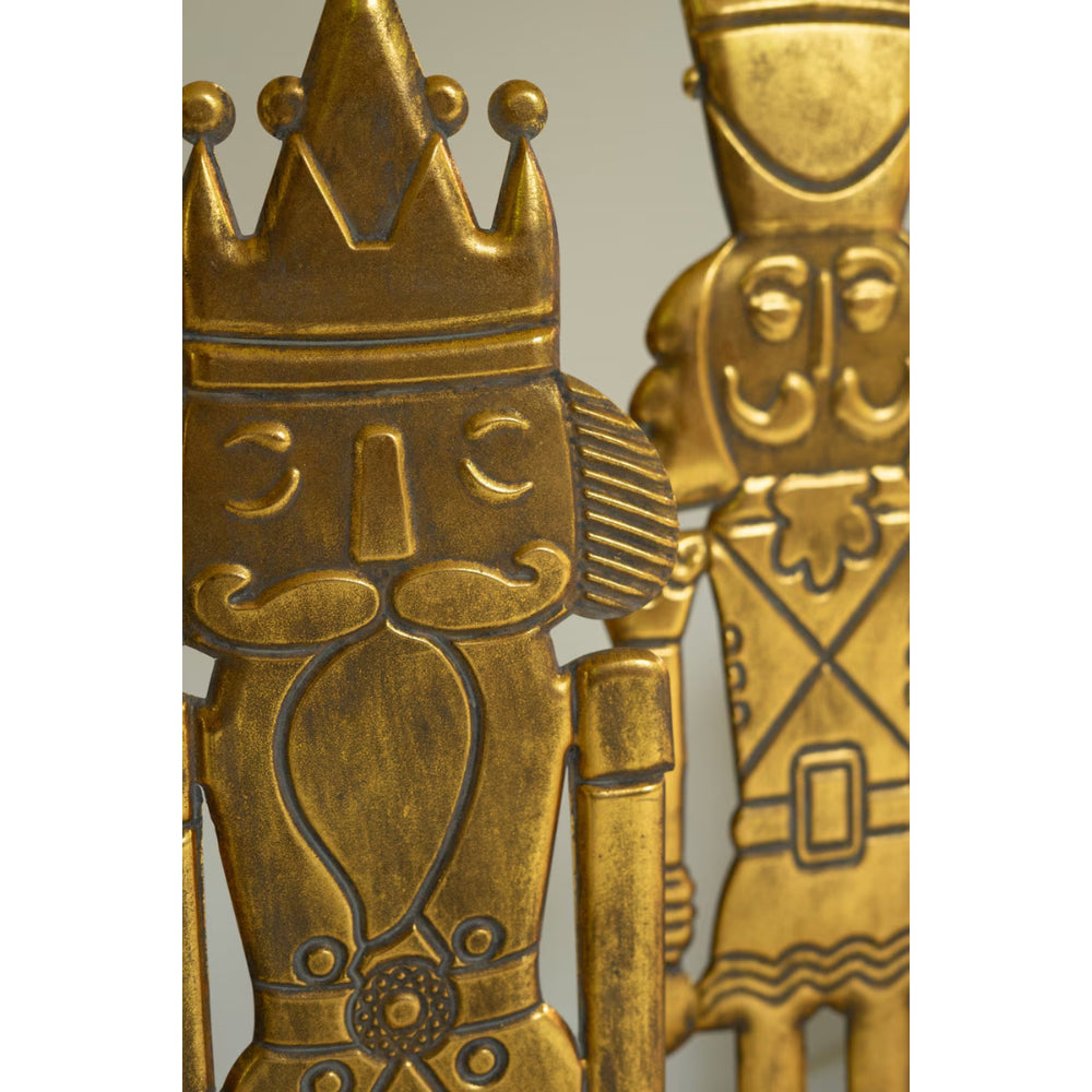 Gold figurine of a warrior with a crown on a white background