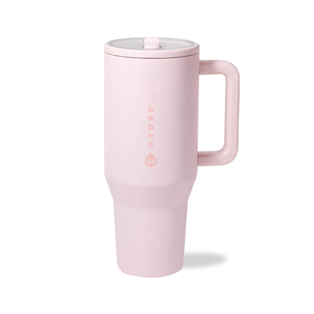 Pink tumbler with a handle on a white background.