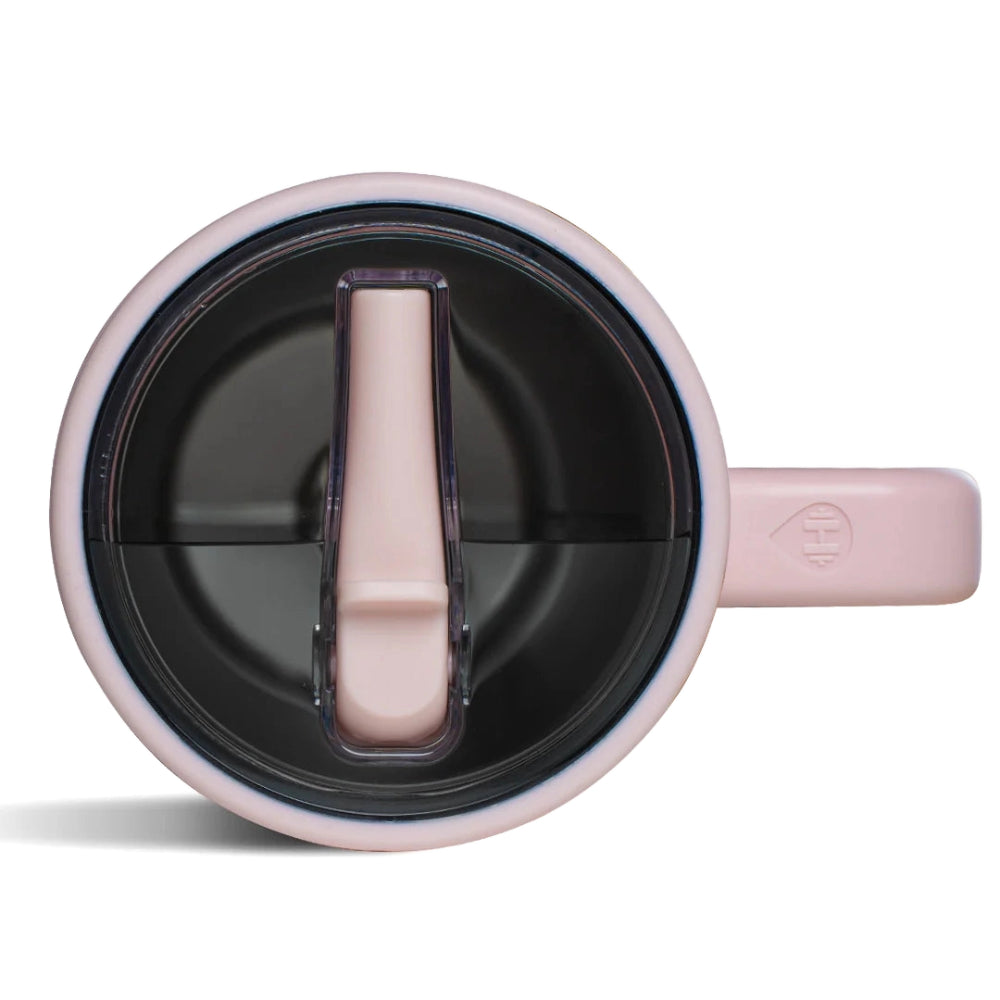 A top photo of a pink mug with a silver interior, pink handle, pink filp straw with darken clear lid on a white background.