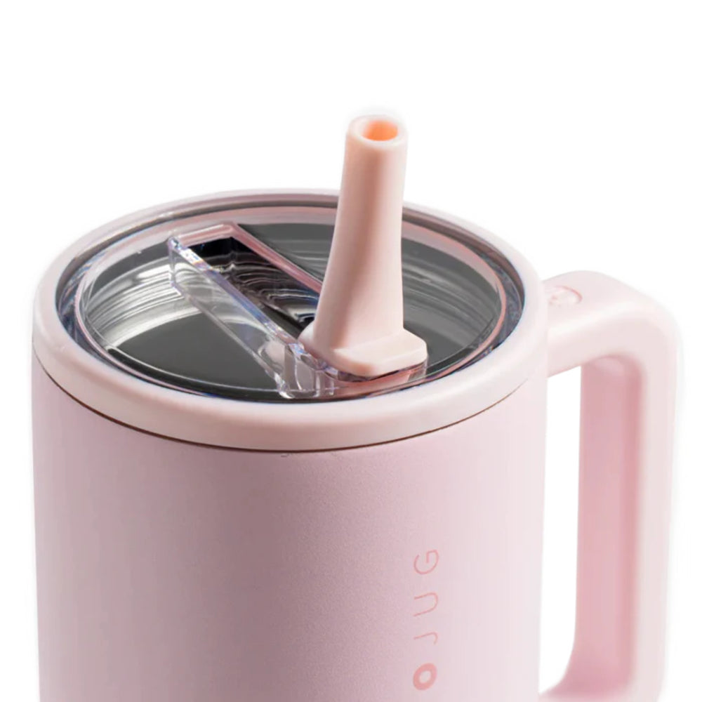 A photo of the side/top of a Pink tumbler with a pink flip straw and clear lid on a white background.
