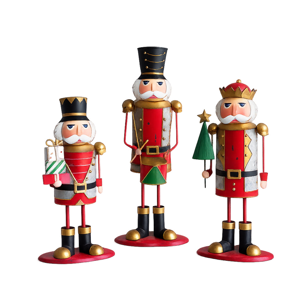 Three festive wooden nutcracker figurines standing on round red bases against a plain white background. The left nutcracker holds a wrapped gift, the center nutcracker stands with hands folded, and the right nutcracker wears a crown and holds a small tree.