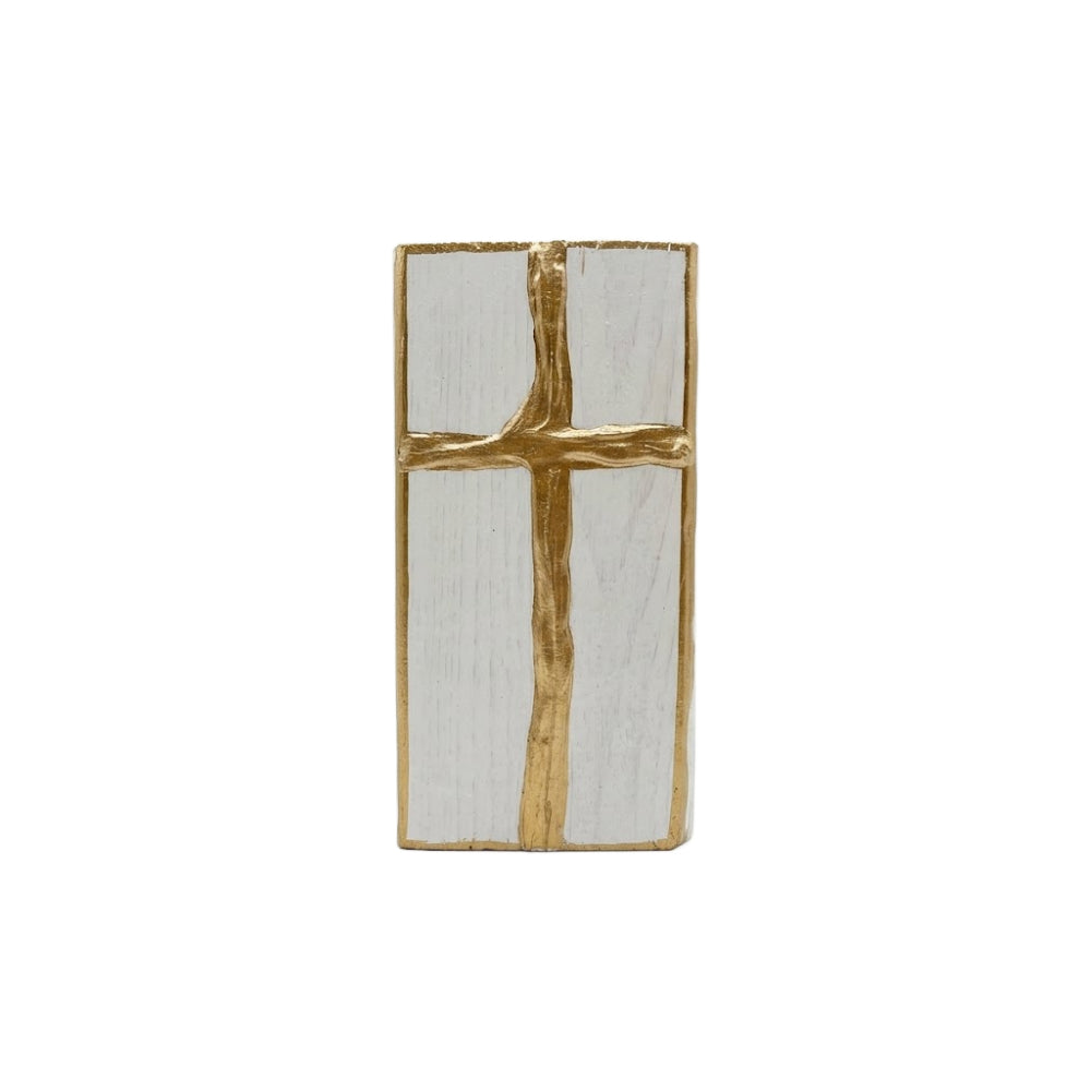Gold cross decorative white wooden block on a white background
