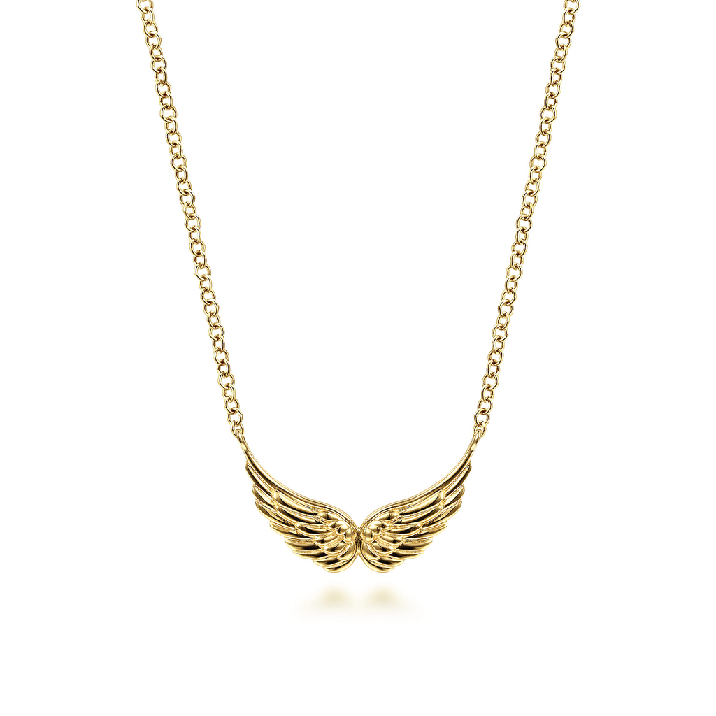 gold necklace with angel wings in the center on white background