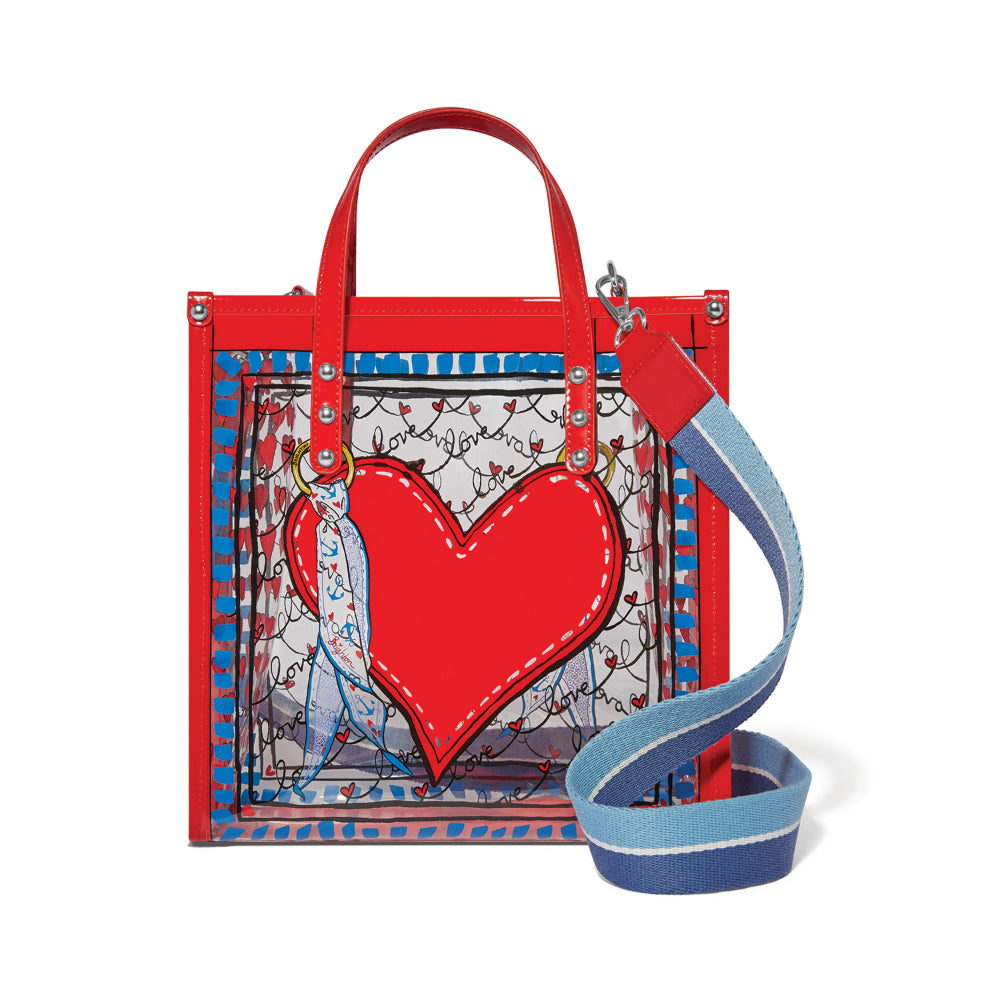 Red tote bag with a heart design and blue strap on a white background.