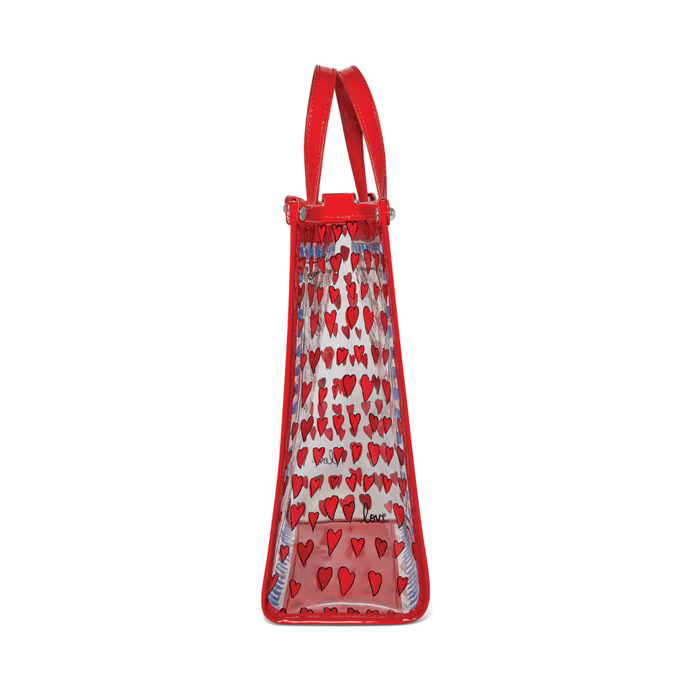 A photo of the side of a red and clear bag with a red heart pattern on a white background.