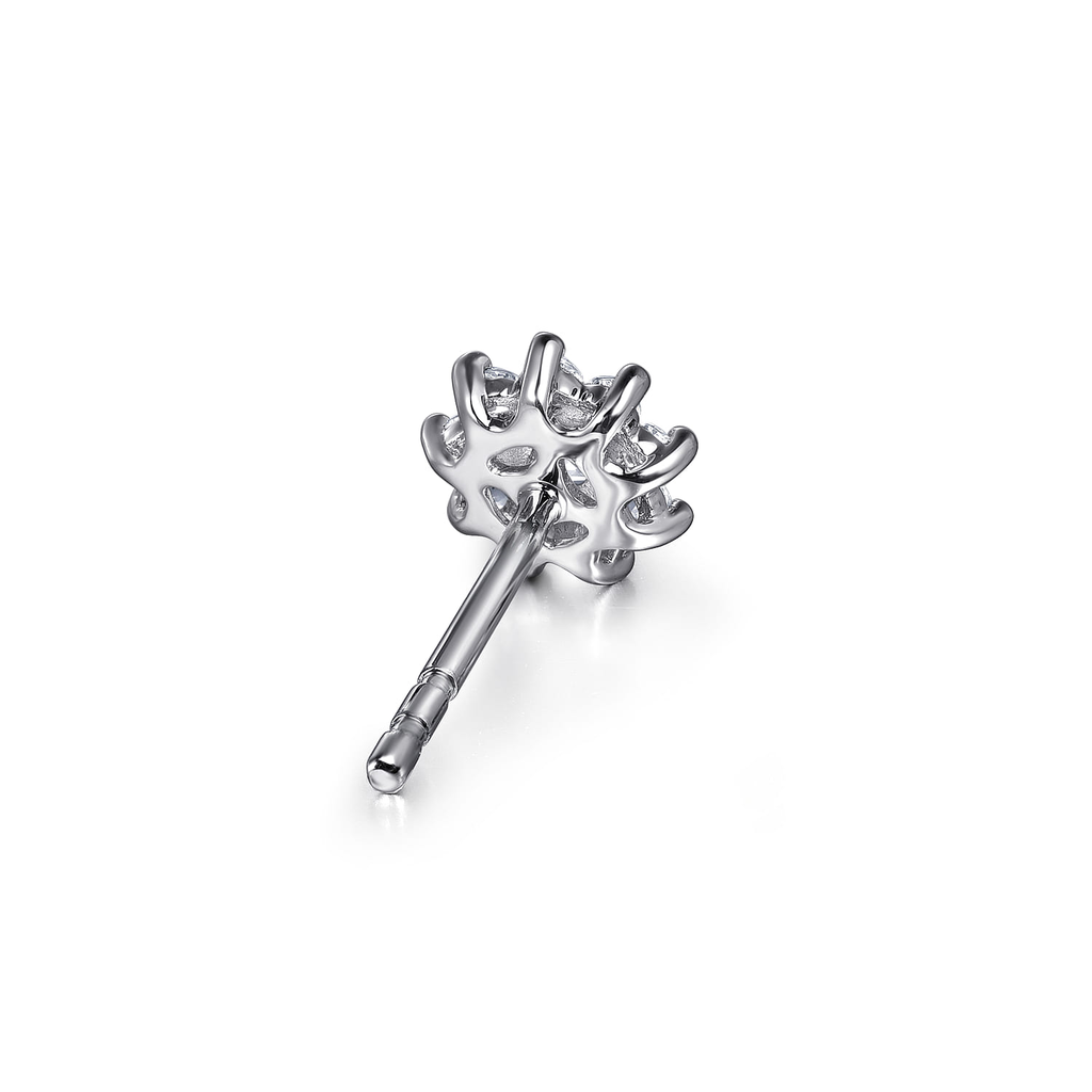 Silver hairpin with decorative top on a white background