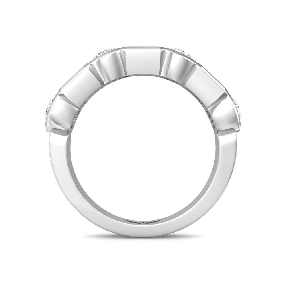 A silver-toned ring with a textured, fluted outer band and small clear gemstones set along the top, shown against a plain white background.
