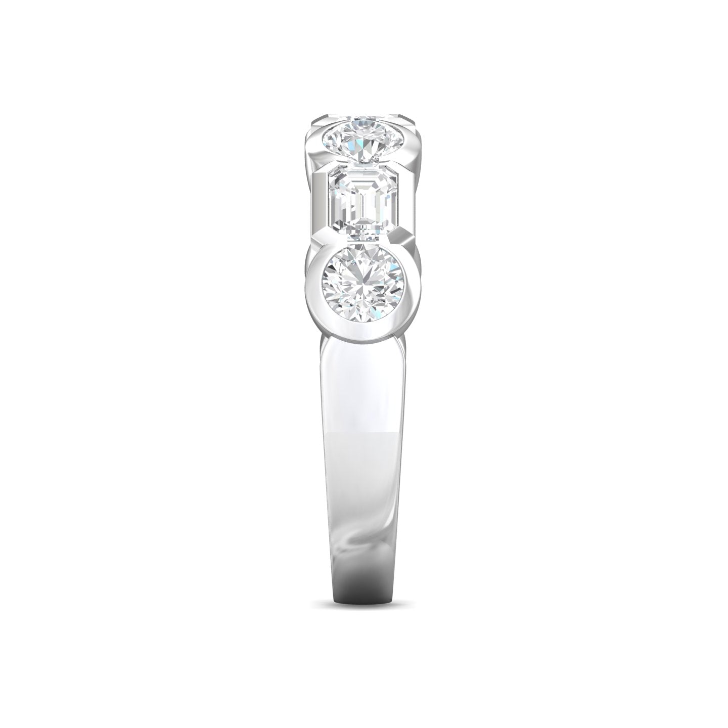 A three-stone diamond engagement ring featuring a round brilliant-cut center stone and two baguette-cut side stones in a silver-colored setting on a white background.