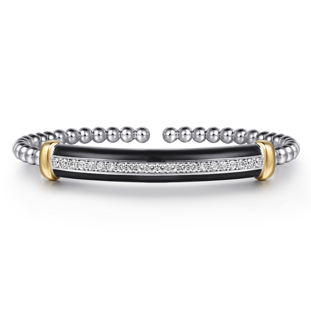 Silver bracelet with black center and gold accents on a white background