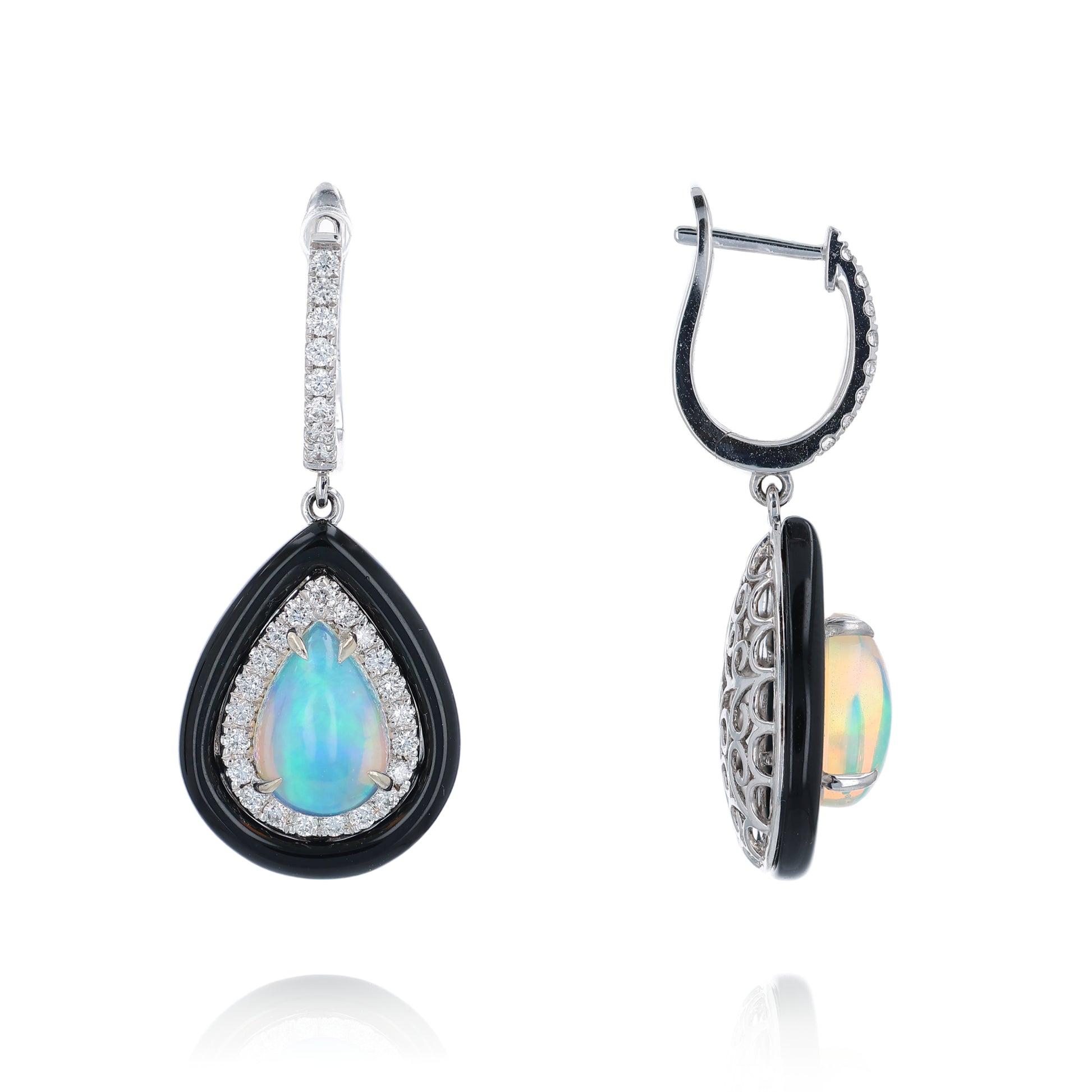 Pair of white gold black framed earrings with pear shaped opals and surrounding diamond halos on a white background