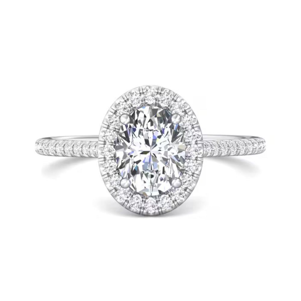 Diamond ring with a halo on a white background
