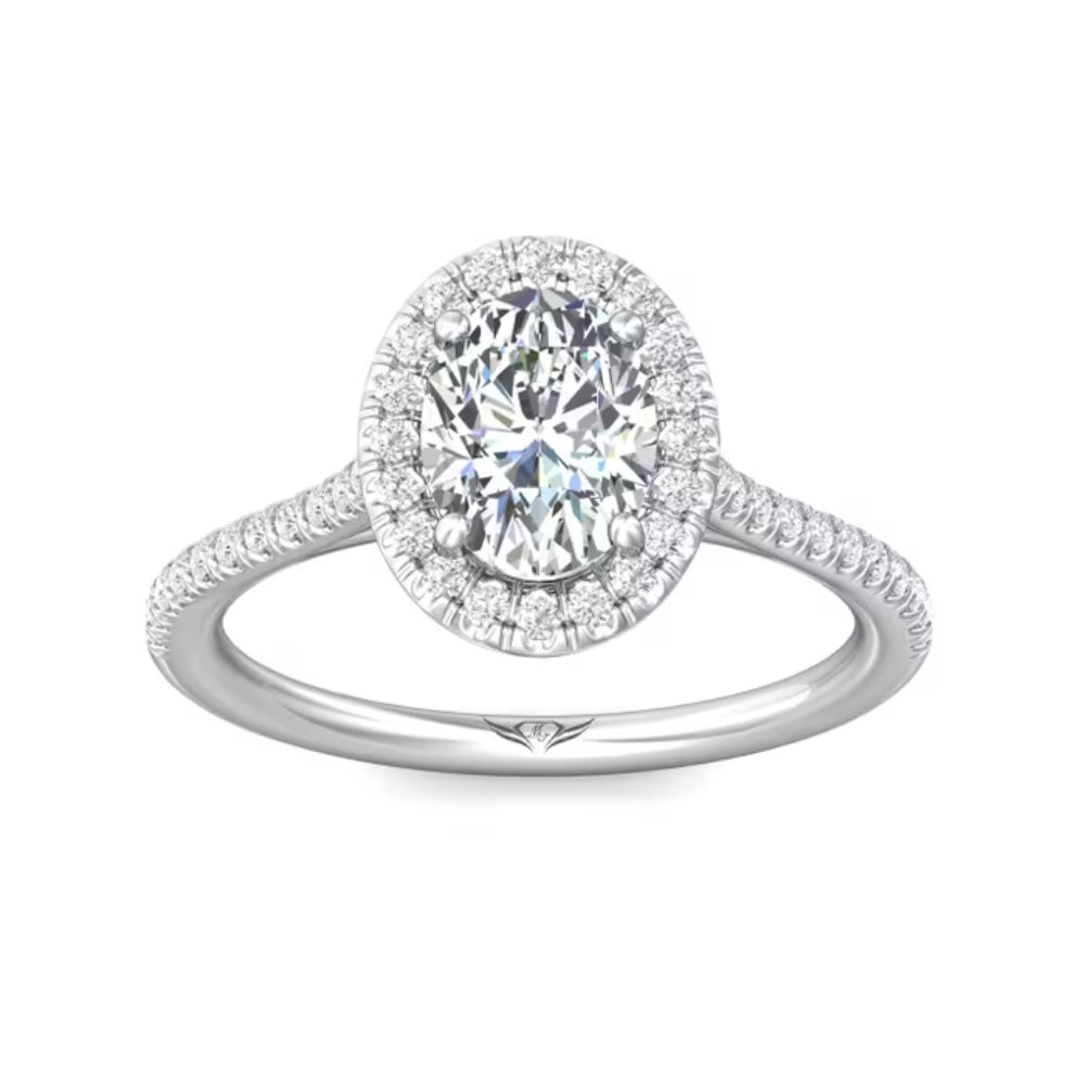Diamond ring with a halo on a white background