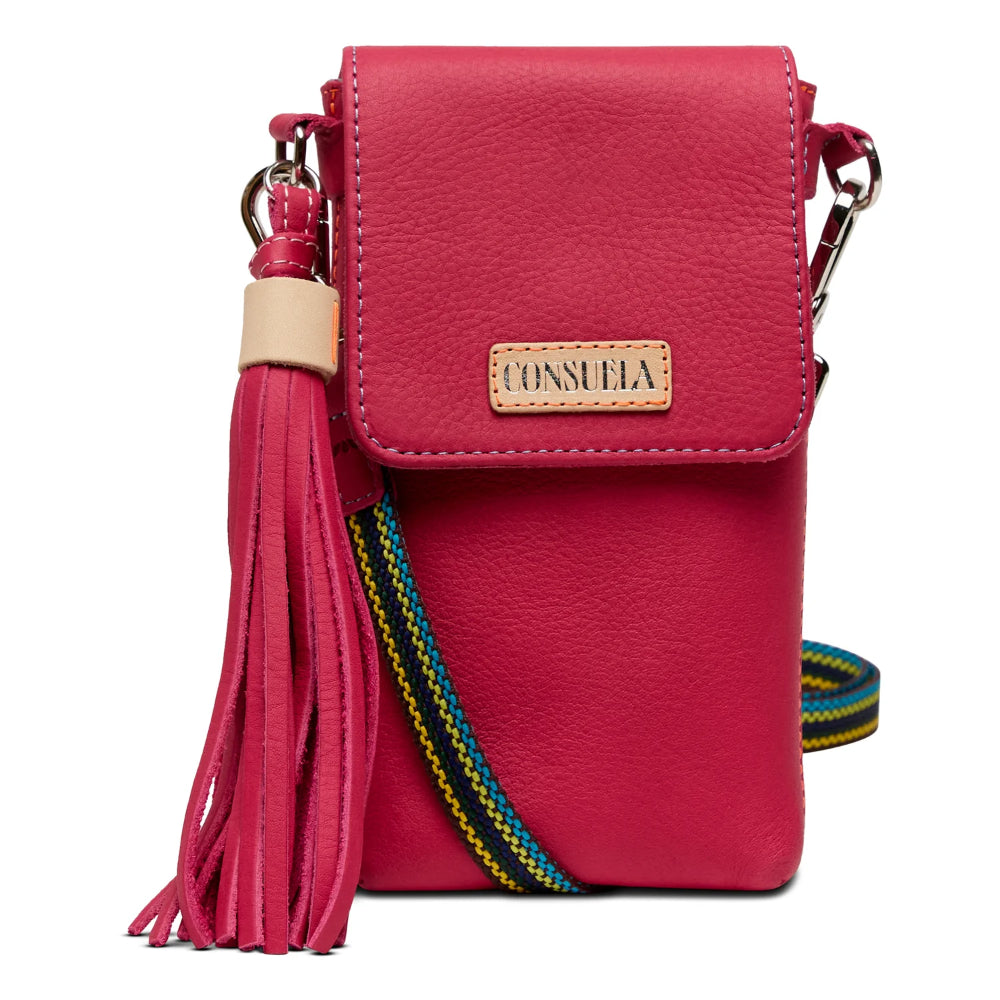 Pink handbag with tassel and colorful strap on a white background