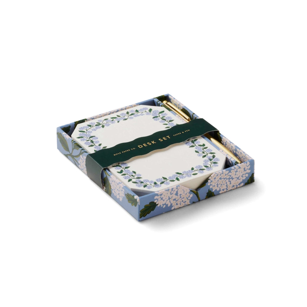 Desk set with floral design packaging on a white background.