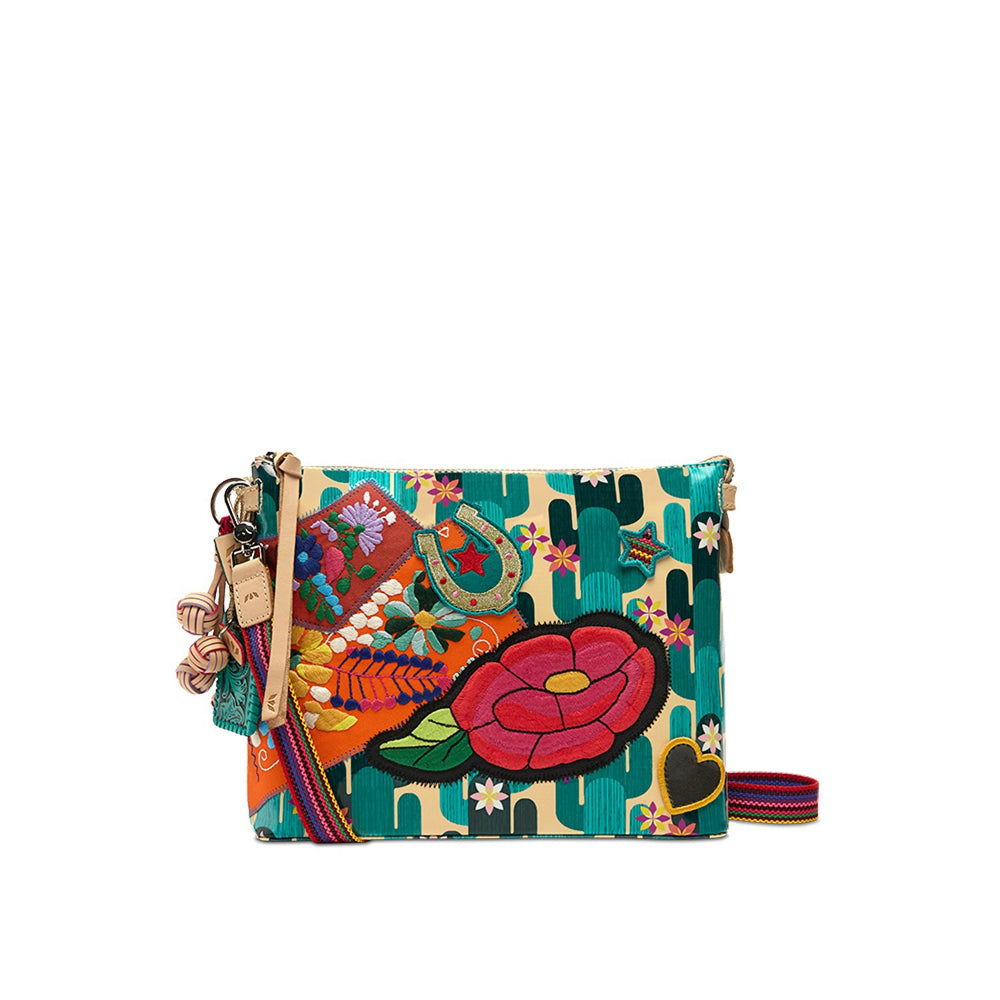 Colorful handbag with floral and abstract designs on a white background