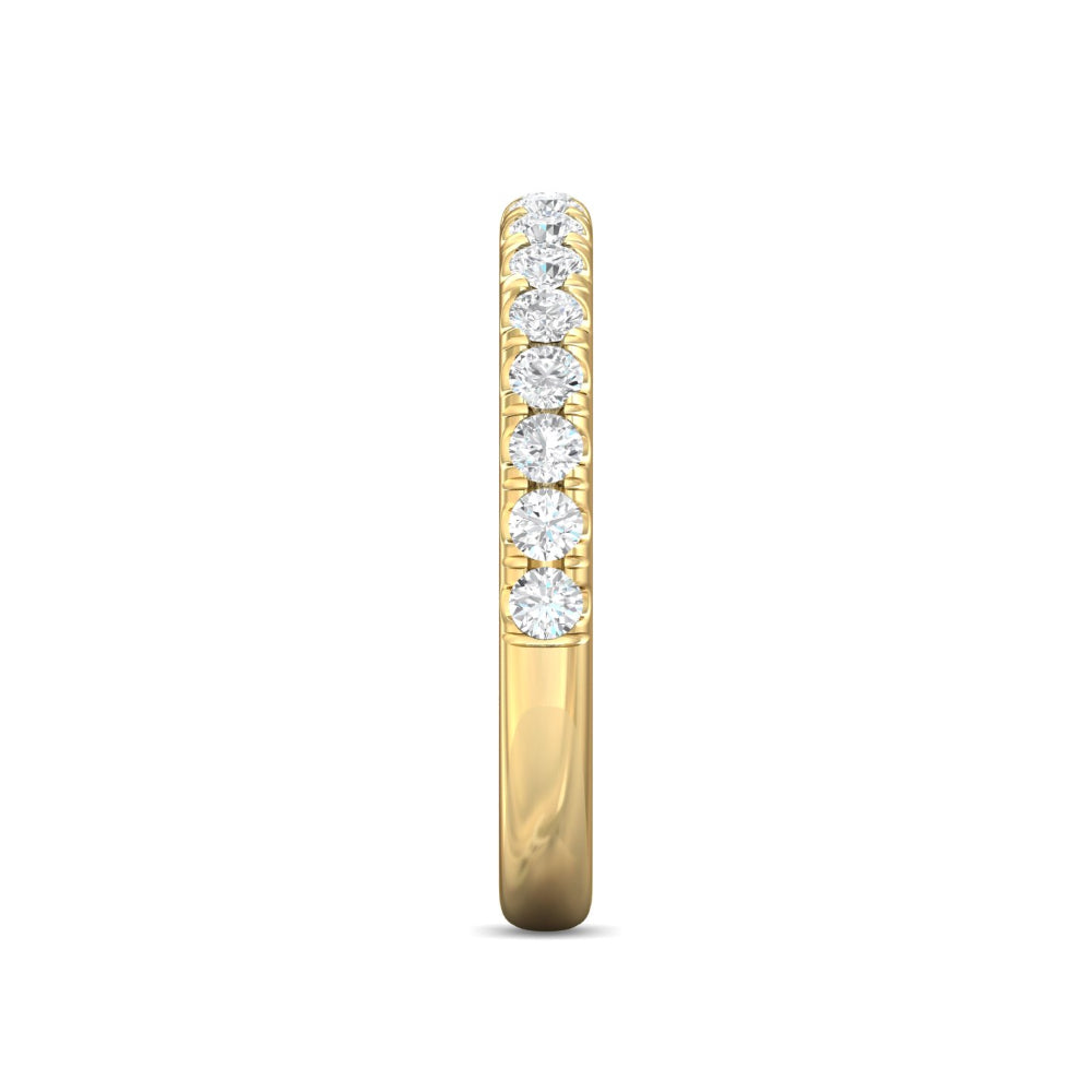 Gold ring with embedded diamonds on a white background