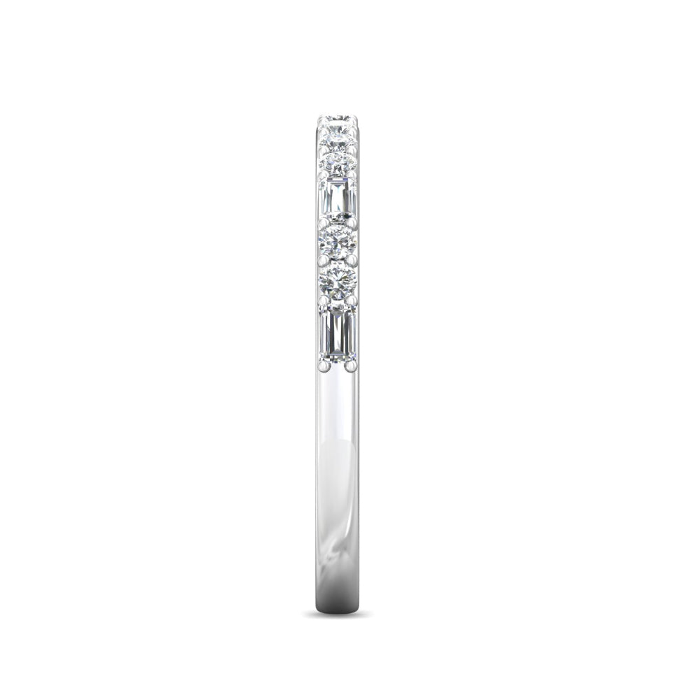 A slim diamond band ring in a silver-toned metal, featuring a row of baguette-cut and round-cut diamonds on a plain white background.