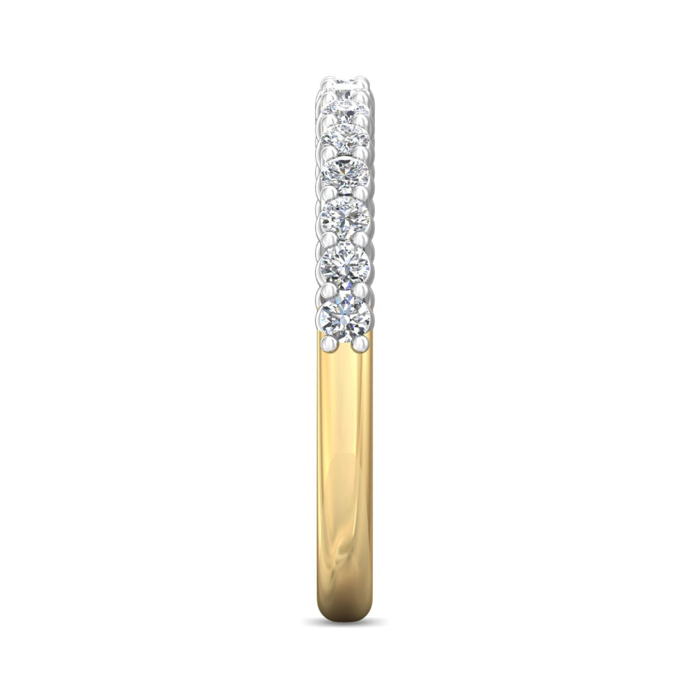 Gold ring with diamond-studded band on a white background